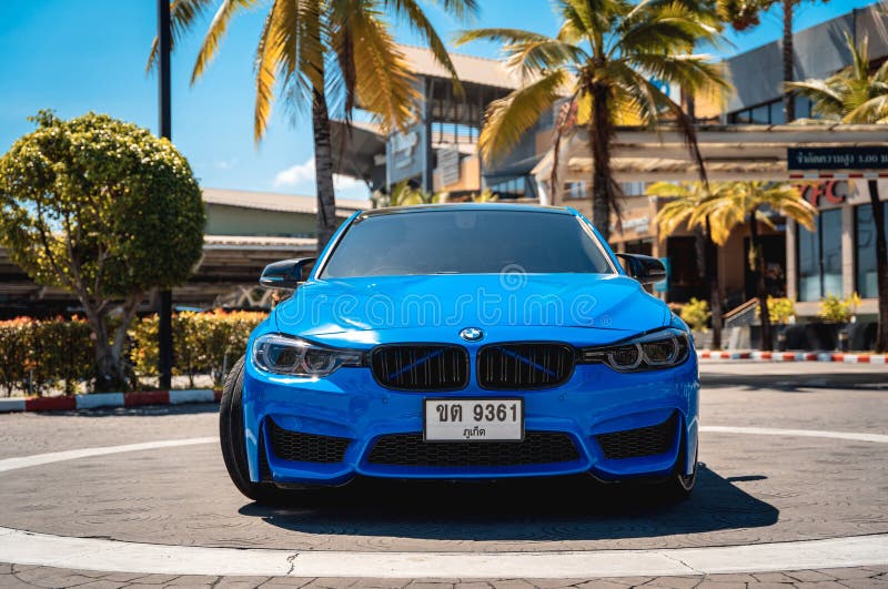 PHUKET, THAILAND- DECEMBER 25, 2023: Beautiful bright blue BMW M3 series in the parking lot. PHUKET, THAILAND- DECEMBER 25, 2023: Beautiful bright blue BMW M3 series in the parking lot