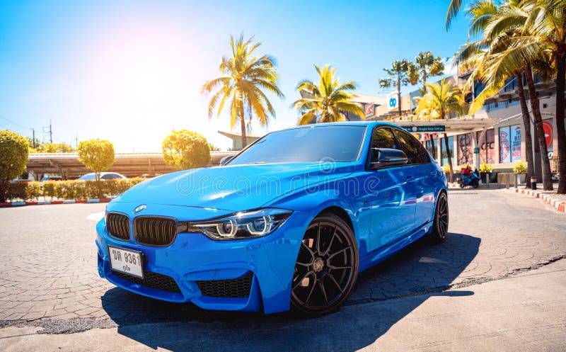 PHUKET, THAILAND- DECEMBER 25, 2023: Beautiful bright blue BMW M3 series in the parking lot. PHUKET, THAILAND- DECEMBER 25, 2023: Beautiful bright blue BMW M3 series in the parking lot