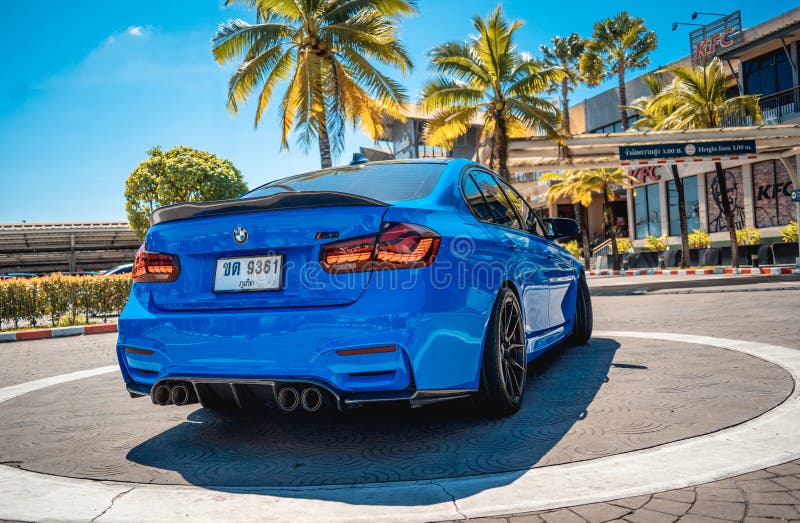 PHUKET, THAILAND- DECEMBER 25, 2023: Beautiful bright blue BMW M3 series in the parking lot. PHUKET, THAILAND- DECEMBER 25, 2023: Beautiful bright blue BMW M3 series in the parking lot