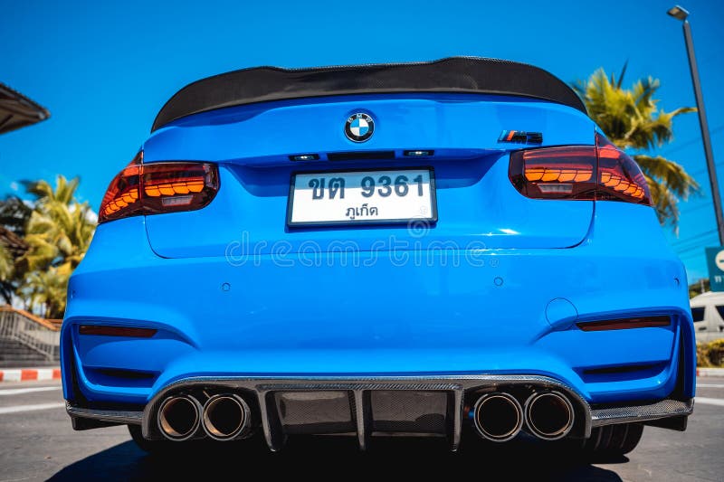 PHUKET, THAILAND- DECEMBER 25, 2023: Beautiful bright blue BMW M3 series in the parking lot. PHUKET, THAILAND- DECEMBER 25, 2023: Beautiful bright blue BMW M3 series in the parking lot