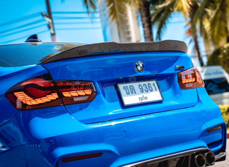 PHUKET, THAILAND- DECEMBER 25, 2023: Beautiful bright blue BMW M3 series in the parking lot. PHUKET, THAILAND- DECEMBER 25, 2023: Beautiful bright blue BMW M3 series in the parking lot