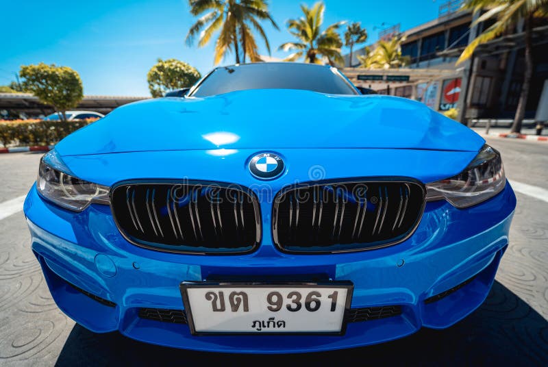 PHUKET, THAILAND- DECEMBER 25, 2023: Beautiful bright blue BMW M3 series in the parking lot. PHUKET, THAILAND- DECEMBER 25, 2023: Beautiful bright blue BMW M3 series in the parking lot
