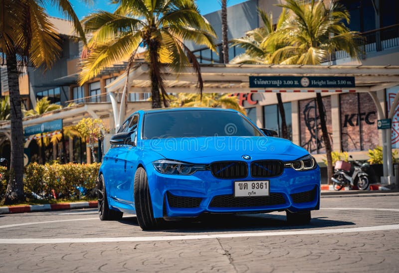 PHUKET, THAILAND- DECEMBER 25, 2023: Beautiful bright blue BMW M3 series in the parking lot. PHUKET, THAILAND- DECEMBER 25, 2023: Beautiful bright blue BMW M3 series in the parking lot