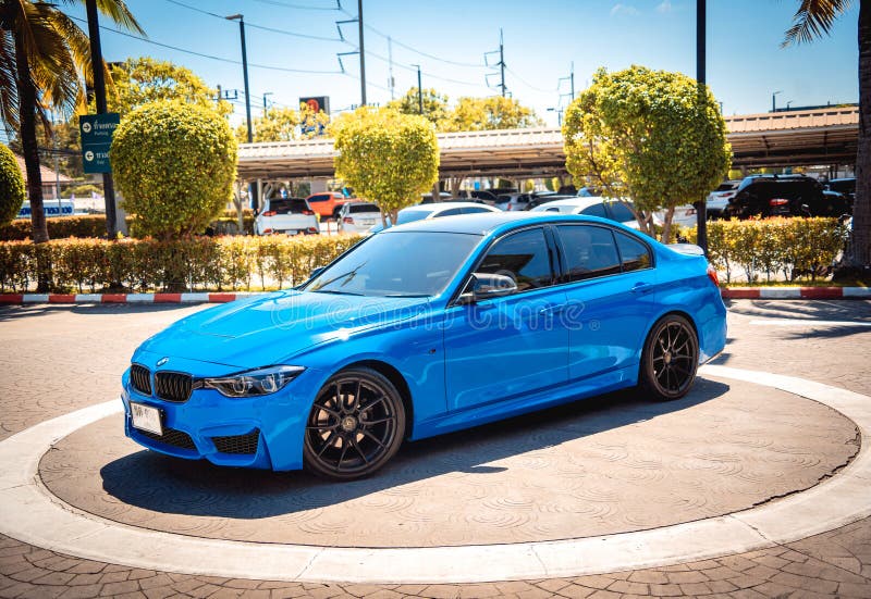 PHUKET, THAILAND- DECEMBER 25, 2023: Beautiful bright blue BMW M3 series in the parking lot. PHUKET, THAILAND- DECEMBER 25, 2023: Beautiful bright blue BMW M3 series in the parking lot