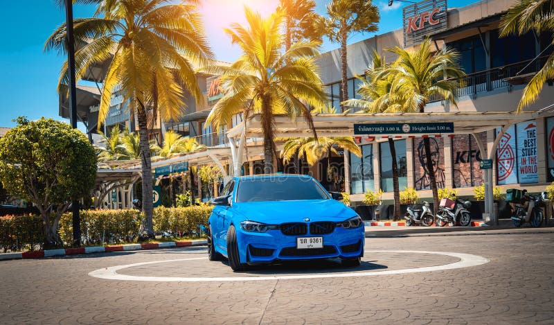 PHUKET, THAILAND- DECEMBER 25, 2023: Beautiful bright blue BMW M3 series in the parking lot. PHUKET, THAILAND- DECEMBER 25, 2023: Beautiful bright blue BMW M3 series in the parking lot