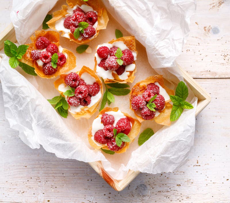 Phyllo cups with Mascarpone cheese filling topped with raspberries, top view