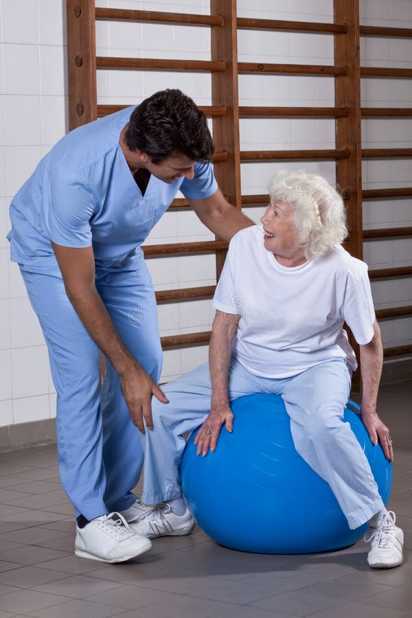 Physical Therapist helping a Patient stock images Physical Therapist helping a Patient stock images