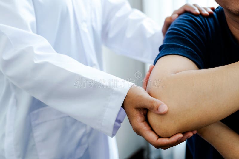 Physical Therapy is Doing Shoulder and Elbow Therapy for Patients in the Hospital Stock Photo
