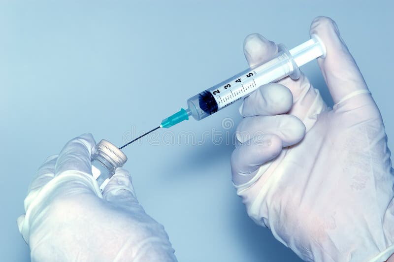 Physician prepares a vaccine