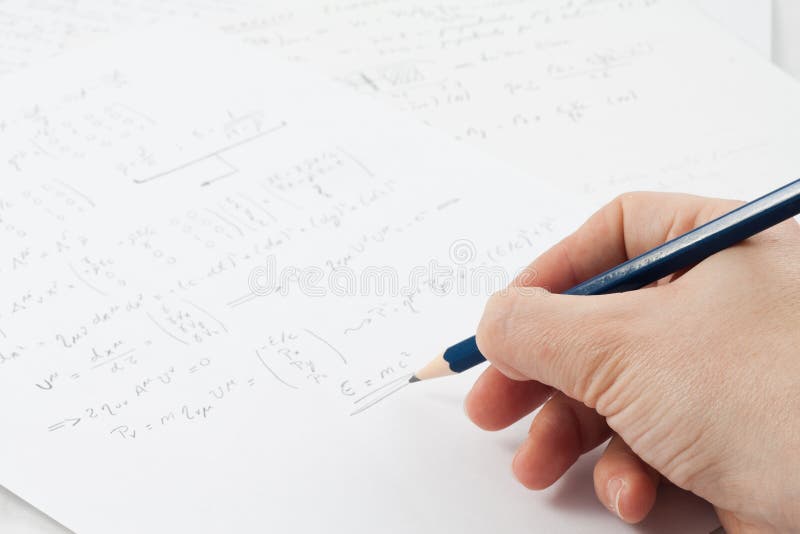 Physics formula on paper stock image