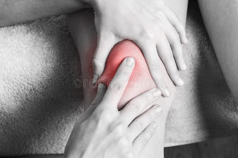 Physiotherapist, chiropractor doing a patellar mobilization, Knee pain in silhouette, color and black and white