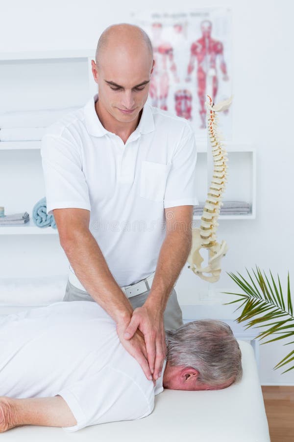 Physiotherapist Doing Neck Massage To His Patient Stock Image Image Of Healthcare