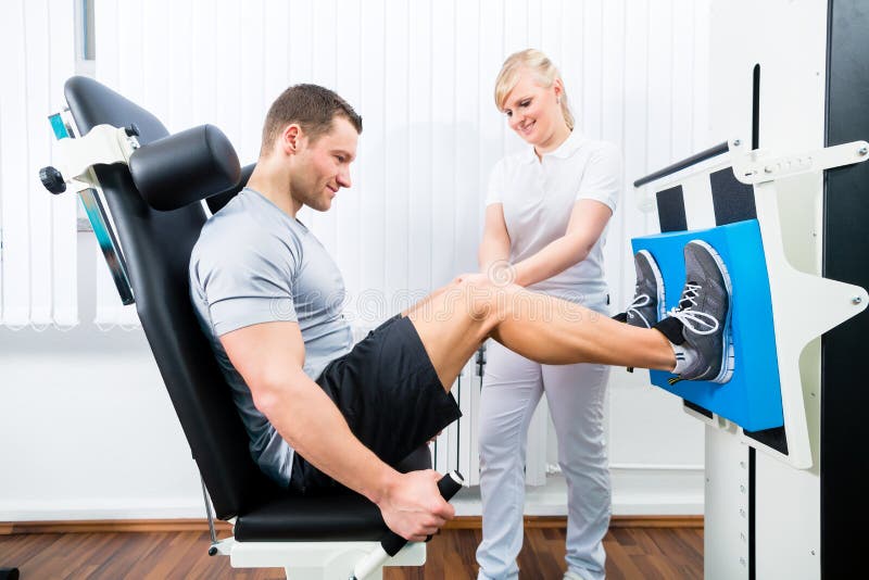 Patient at the physiotherapy doing physical exercises using leg press in sport remobilization. Patient at the physiotherapy doing physical exercises using leg press in sport remobilization