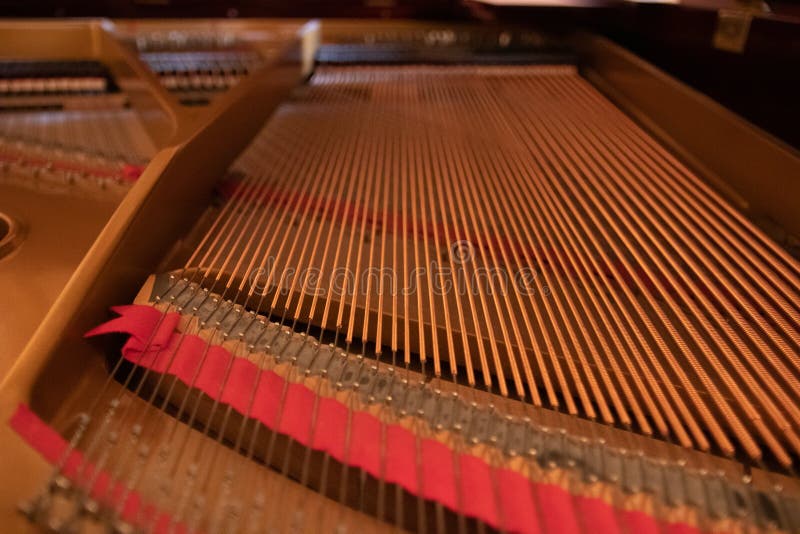 A Piano with a Harp Stands in the Corner of a Luxury Room with Vintage