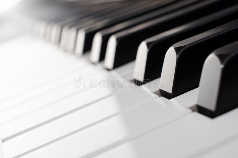 A close up shot of piano keyboard - low angle diagonal view. A close up shot of piano keyboard - low angle diagonal view