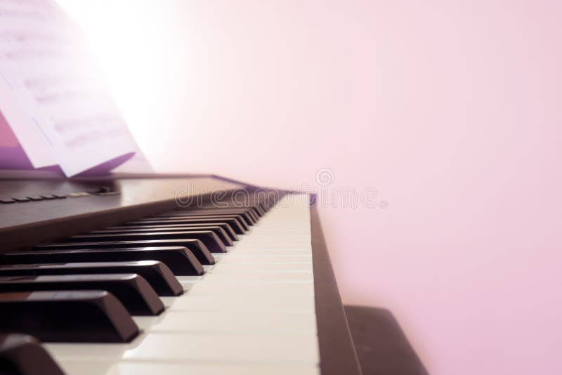Piano keyboard with note. Pink color filter with light effect. Copy space. Classical music instrument. Art and abstract background. Abstract classical stock images, royalty-free photos and pictures