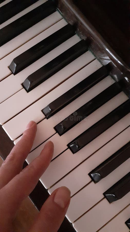 Piano keys and fingers stock photo. Image of piano, writing 164354414