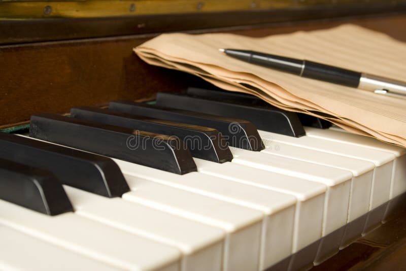 Piano with notes stock photos