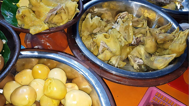 dishes served in Indonesian food Liwet Rice. A Traditional javanese Rice Served with Chicken, Tofu, Tempeh, vegetable, Chili, egg in street food. dishes served in Indonesian food Liwet Rice. A Traditional javanese Rice Served with Chicken, Tofu, Tempeh, vegetable, Chili, egg in street food