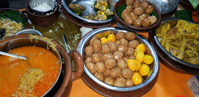 dishes served in Indonesian food Liwet Rice. A Traditional javanese Rice Served with Chicken, Tofu, Tempeh, vegetable, Chili, egg in street food. dishes served in Indonesian food Liwet Rice. A Traditional javanese Rice Served with Chicken, Tofu, Tempeh, vegetable, Chili, egg in street food