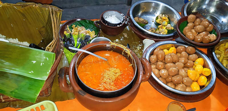 dishes served in Indonesian food Liwet Rice. A Traditional javanese Rice Served with Chicken, Tofu, Tempeh, vegetable, Chili, egg in street food. dishes served in Indonesian food Liwet Rice. A Traditional javanese Rice Served with Chicken, Tofu, Tempeh, vegetable, Chili, egg in street food