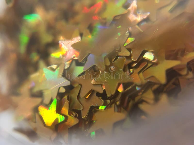 Piccola stella d'oro, scintillio per la pittura del chiodo immagini stock Piccola stella d'oro, scintillio per la pittura del chiodo immagini stock