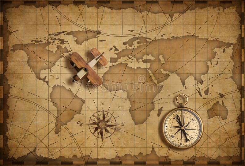 Piccolo aeroplano di legno sopra la mappa nautica del mondo come concetto di comunicazione e di viaggio