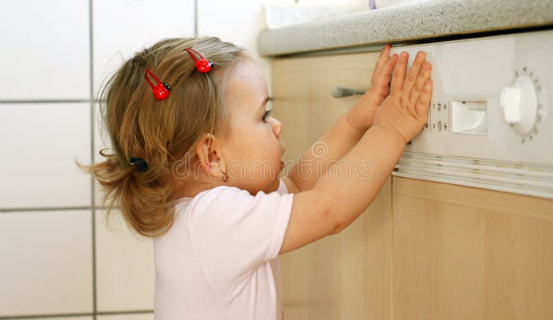 Small girl is helping in the kitchen. Small girl is helping in the kitchen