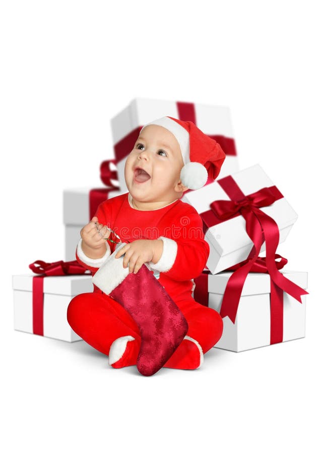 Piccolo bambino divertente Santa Claus con i regali di Natale isolati su w fotografia stock libera da diritti Piccolo bambino divertente Santa Claus con i regali di Natale isolati su w fotografia stock libera da diritti