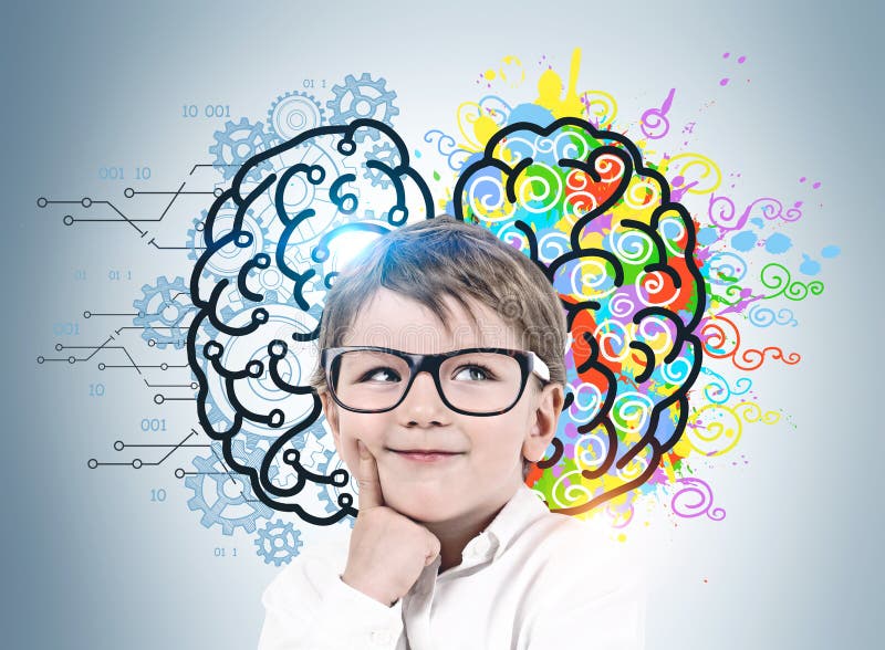 Adorable smiling little boy with glasses standing near gray wall with colorful left and right brain sketch. Concept of brainstorming and education. Adorable smiling little boy with glasses standing near gray wall with colorful left and right brain sketch. Concept of brainstorming and education