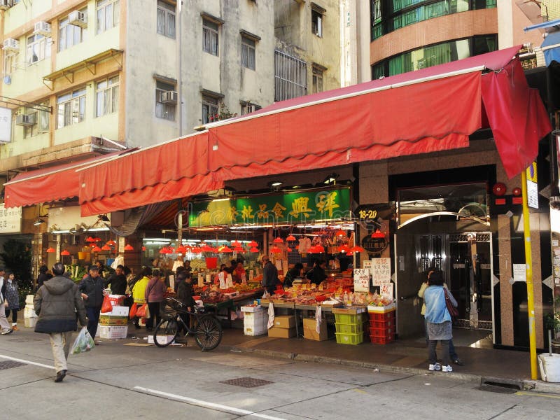 Typical Chinese grocery shops beneath flats in Hong Kong. Typical Chinese grocery shops beneath flats in Hong Kong
