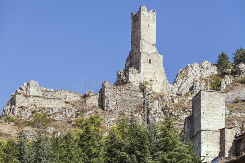 Cityscape with Piccolomini tower and castle ruins at historical village, shot in bright light at Pescina, L`Aquila, Abruzzo, Italy. Cityscape with Piccolomini tower and castle ruins at historical village, shot in bright light at Pescina, L`Aquila, Abruzzo, Italy