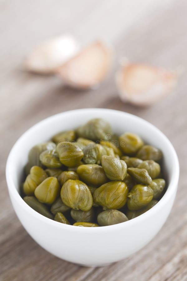 Pickled Capers in Small Bowl stock image