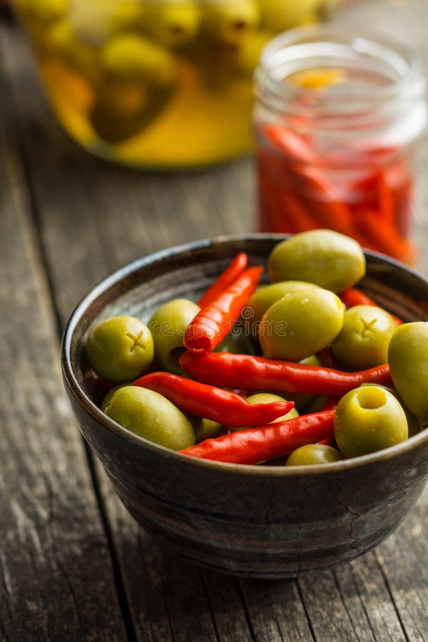 Pickled Chili Peppers and Green Olives. Stock Photo Image of eating