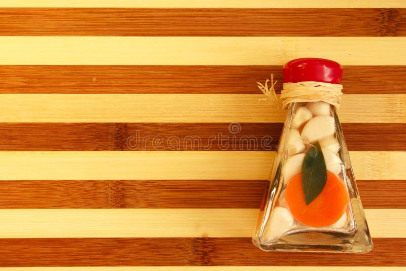 Pickled garlic decorative stock image. Image of bottle 22023217