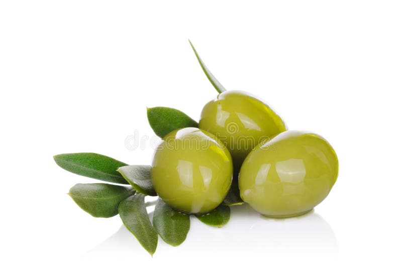 Pickled green olives and olive tree branch on a white