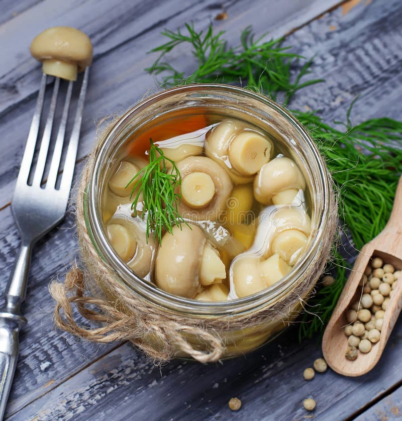 Marinated Mushrooms in a Glass Jar and Garlic Stock Photo Image of