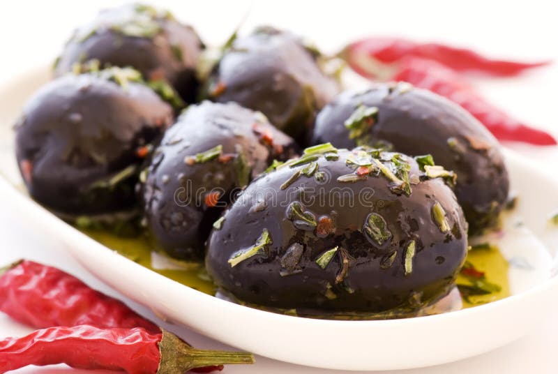 Pickled Olives with Chili stock image. Image of plate 16872573