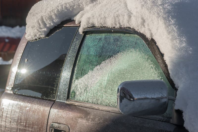 Truck Cab with Heavy Snow and Ice Cover in Winter. A pickup truck is covered with heavy snow and the windows are all iced up stock photo Truck Cab with Heavy Snow and Ice Cover in Winter. A pickup truck is covered with heavy snow and the windows are all iced up stock photo