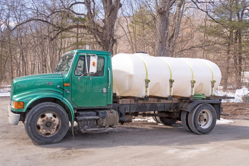 Pickup truck and maple sugar container in bed