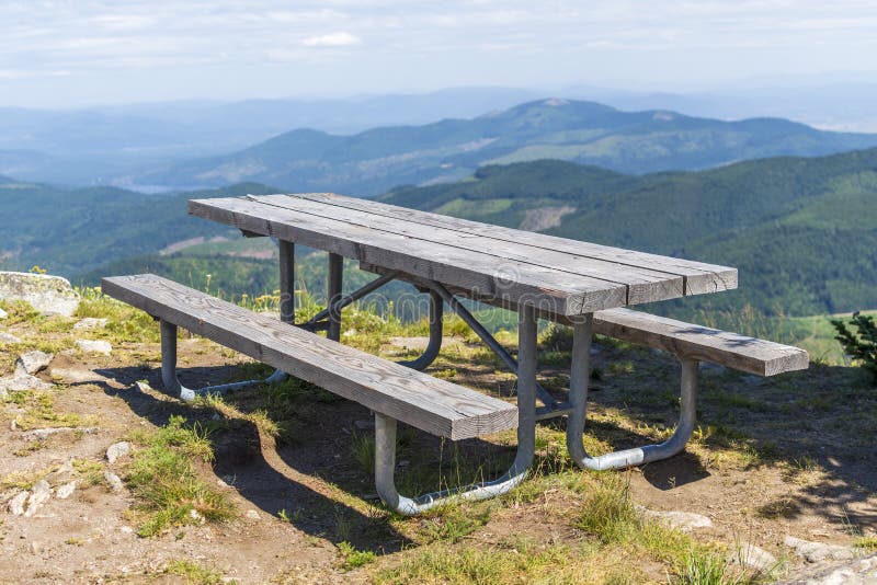 A picnic table sits atop Mt Spokane State Park looking over the Spokane Washington area, from the highest view point in Spokane royalty free stock photos A picnic table sits atop Mt Spokane State Park looking over the Spokane Washington area, from the highest view point in Spokane royalty free stock photos