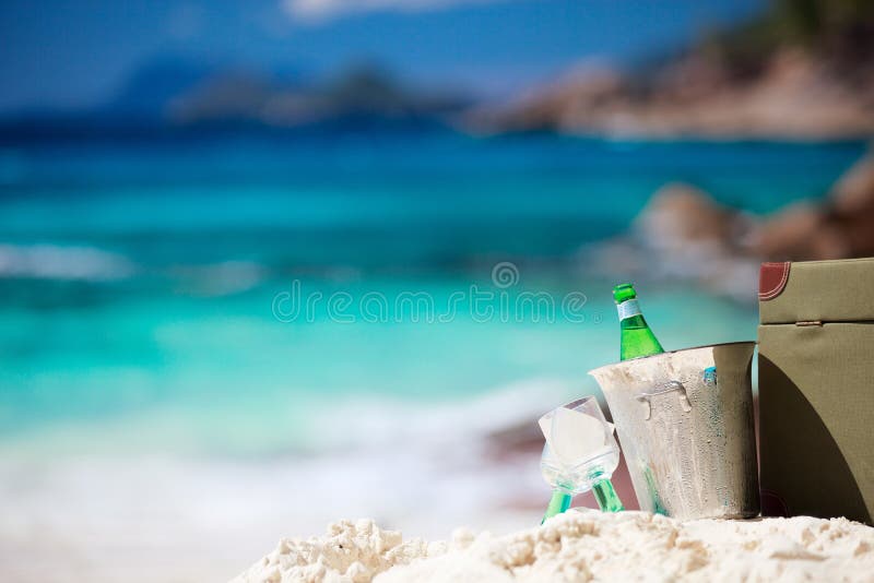 Beer Bottle on a Sandy Beach with Clear Sky and Wave Stock Photo ...