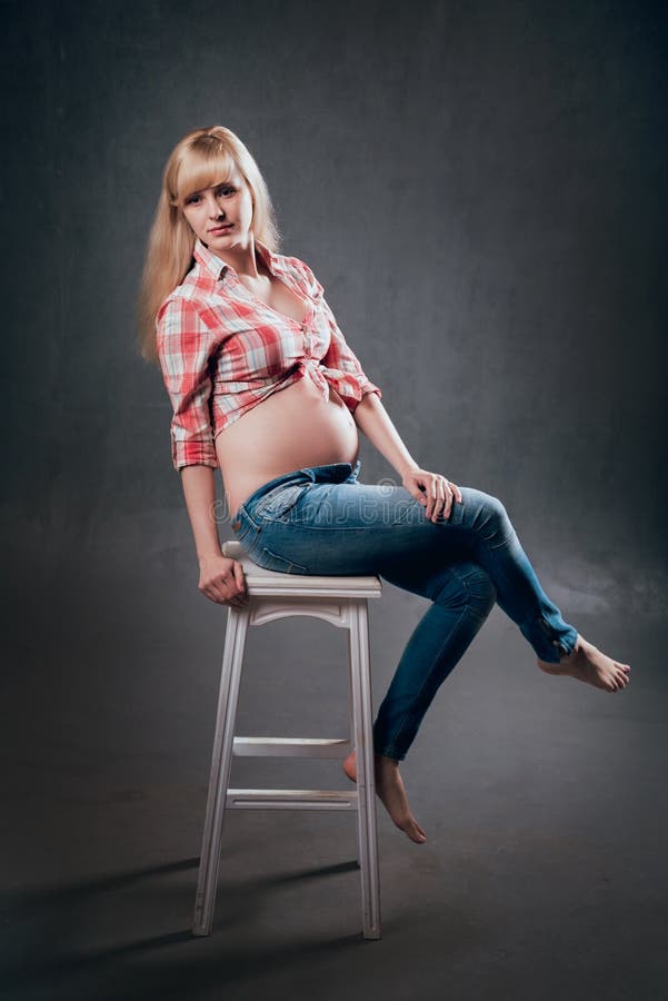 Picture of beautiful pregnant woman. Studio shooting.