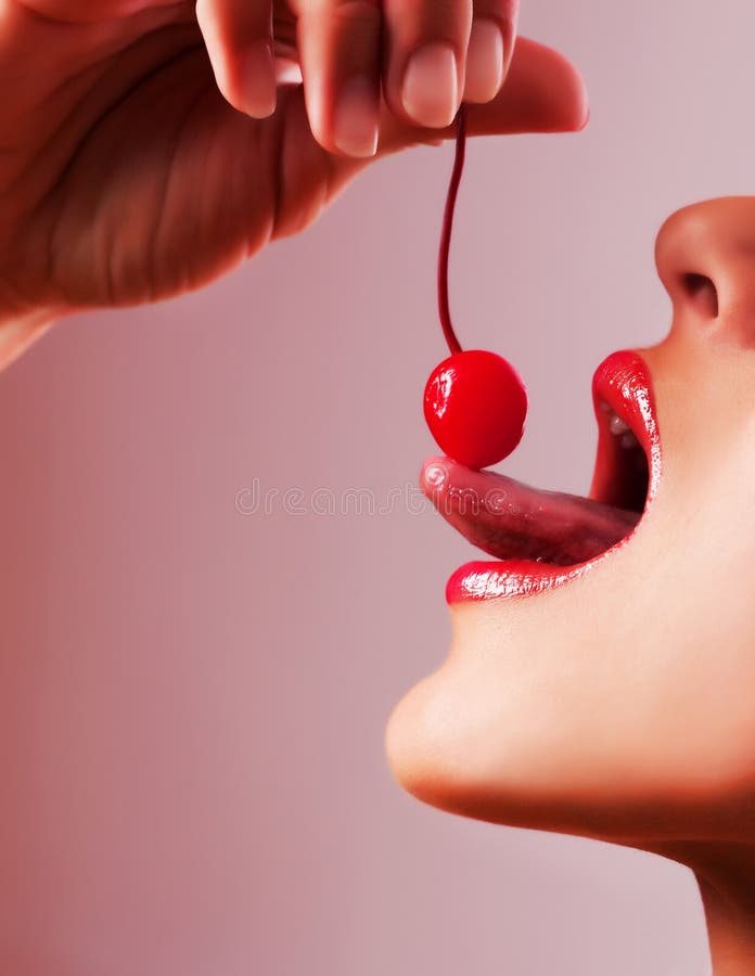 Picture of cocktail cherry, lips and tongue