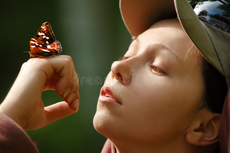 Picture of a happy girl with a butterfly