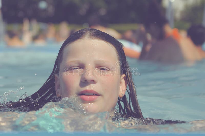 A Picture of a Little Girl at a Swimming Pool in Summer. a Small Girl ...