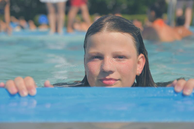 A Picture of a Little Girl at a Swimming Pool in Summer. a Young Girl ...