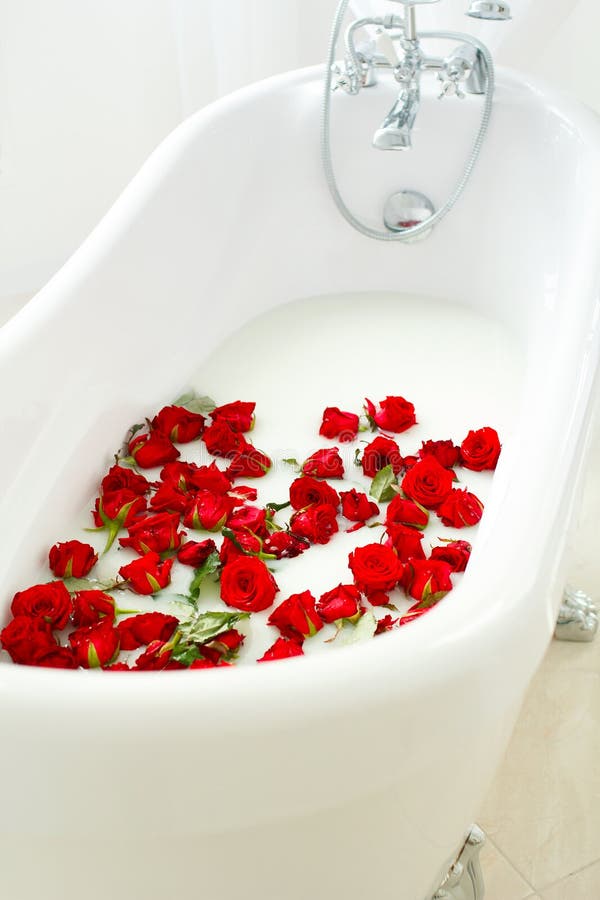 Spa Relax in Flower Bath. Spa Salon. Bath with Rose Petals. Relaxation with Rose