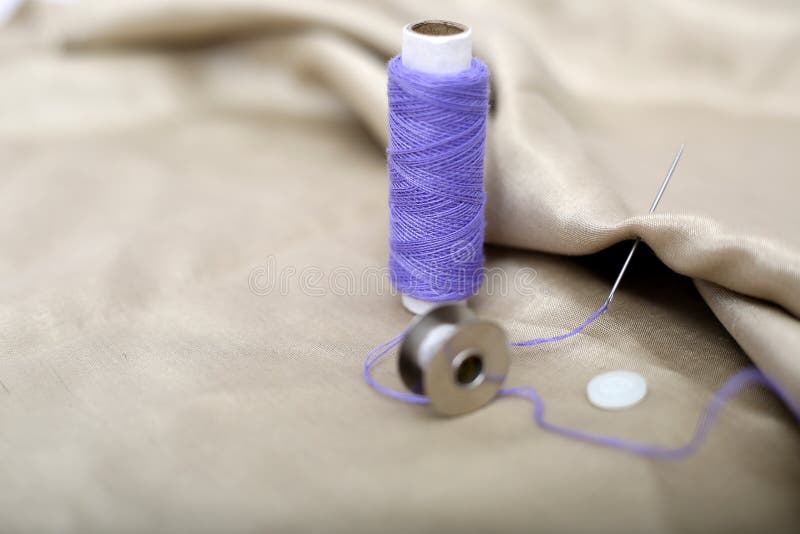 Picture of Needle Attached in Cloth with Purple Sewing Thread and