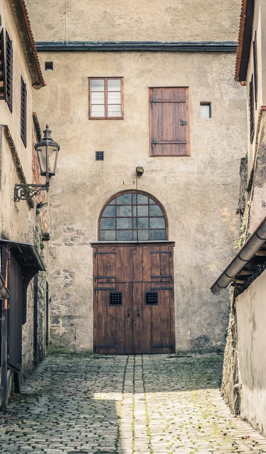 Old european wooden door down the alleyway